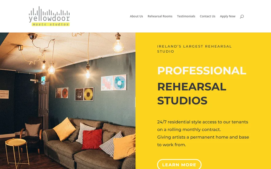 Yellow Door Music Studios homepage: a warmly lit studio lounge beside the headline 'Professional Rehearsal Studios'